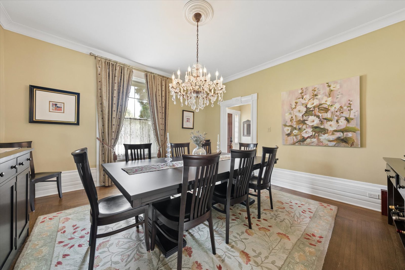 Formal dining room with crystal chandelier and hardwood floors