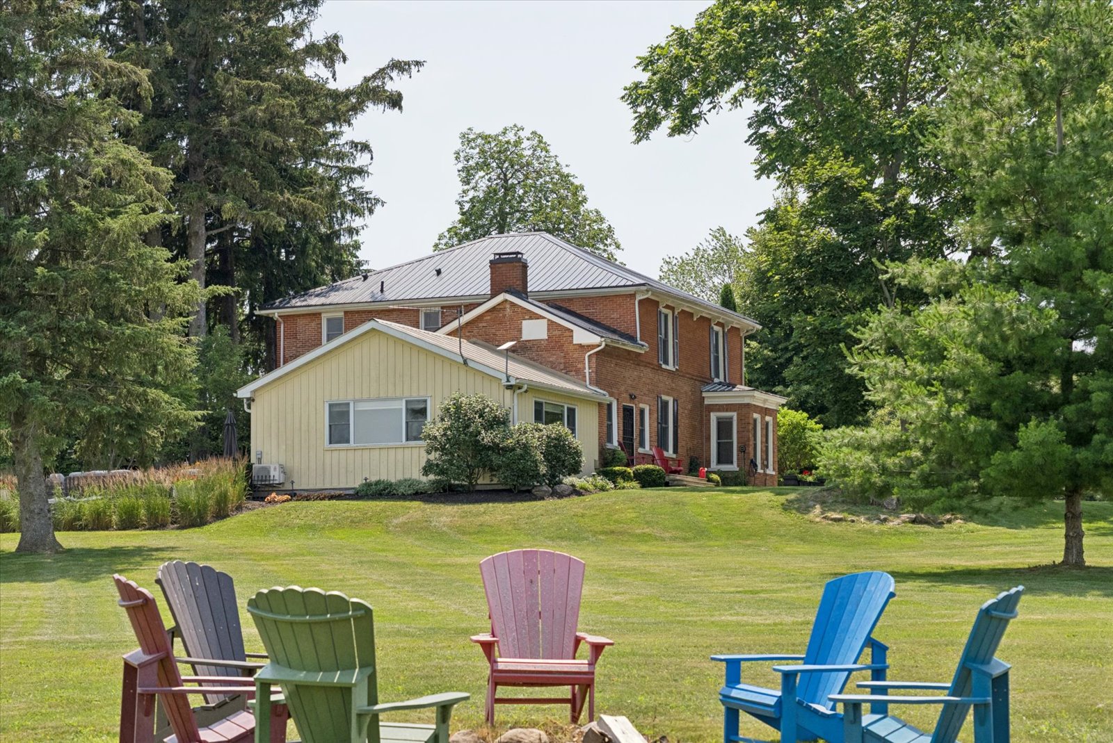 Muskoka chair circle looking back at the house