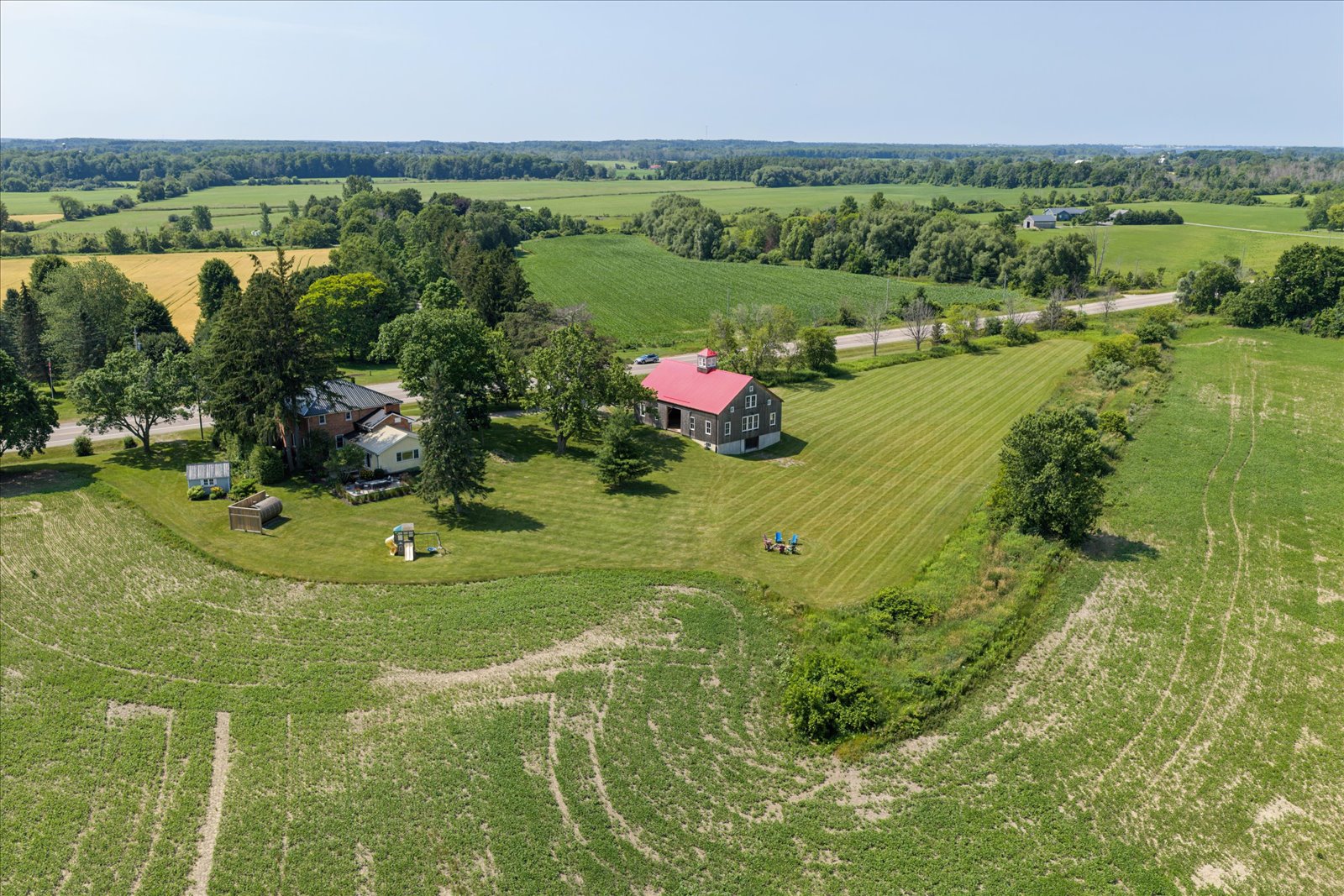 Aerial of the whole farm with fields to the horizon