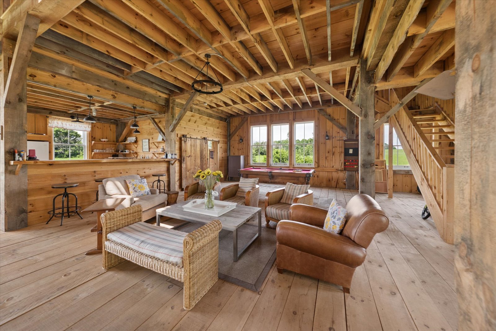 Barn lounge with billiards table and loft stair