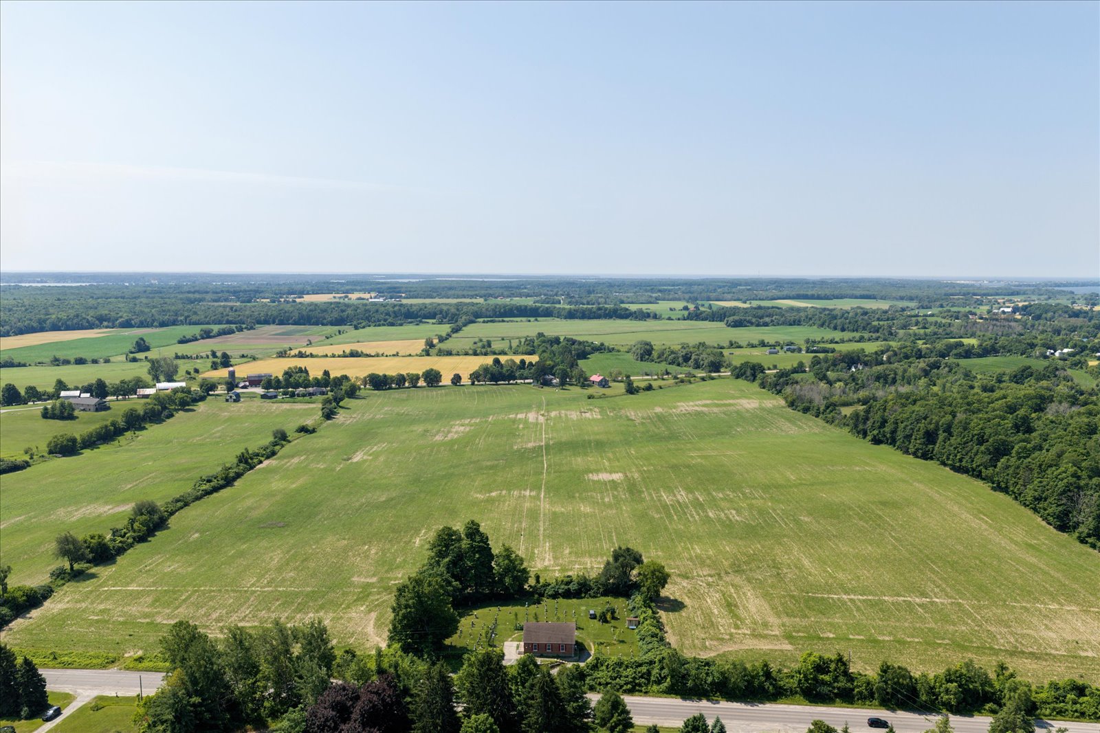 Aerial across the 68 acres of workable farmland toward the bay