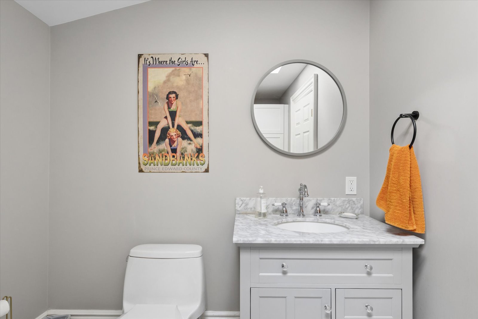 Powder room with marble-topped vanity