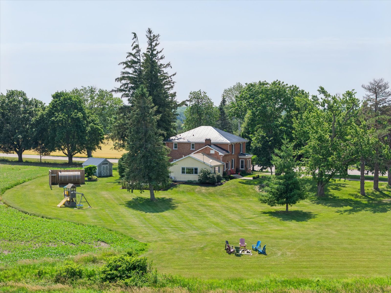 The house, play structure and fire pit from above