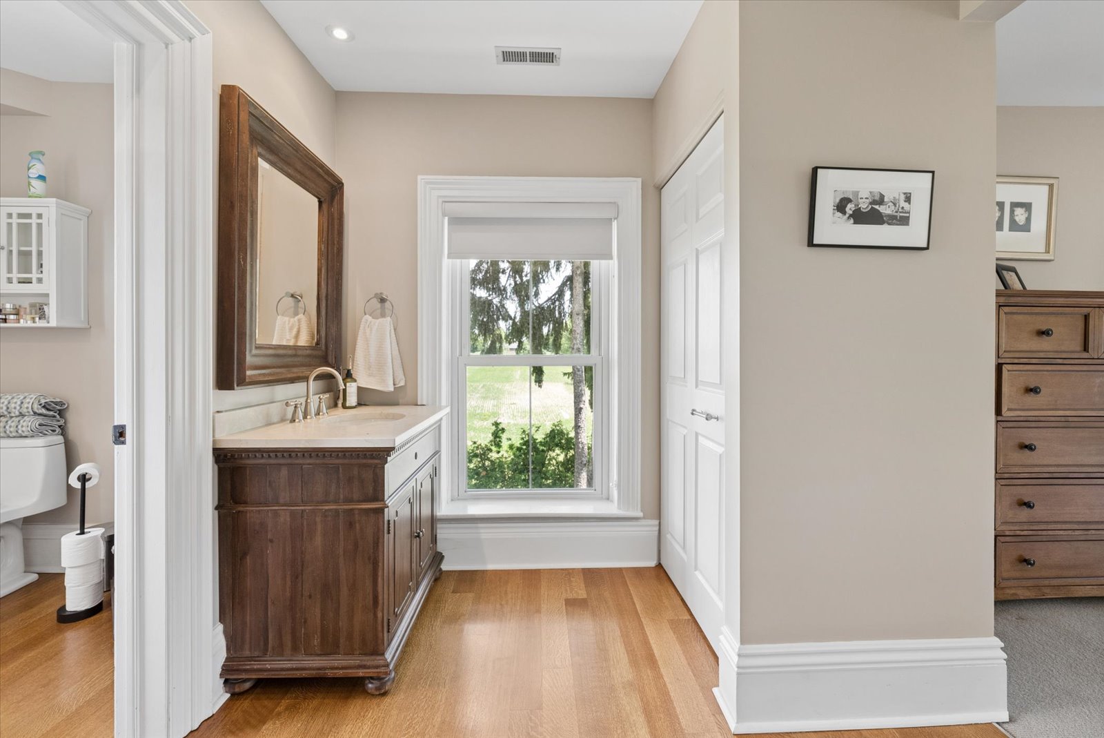 Ensuite vanity with window over the fields