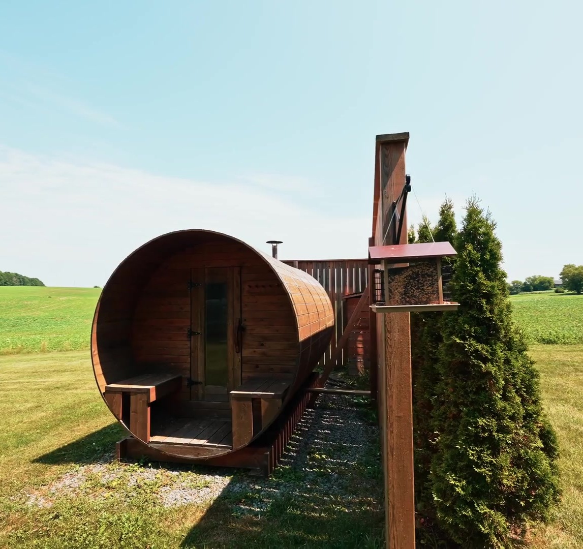 Cedar barrel sauna in the field
