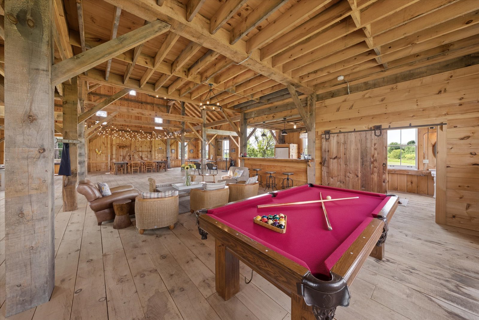 Billiards table in the barn's timber-framed games area