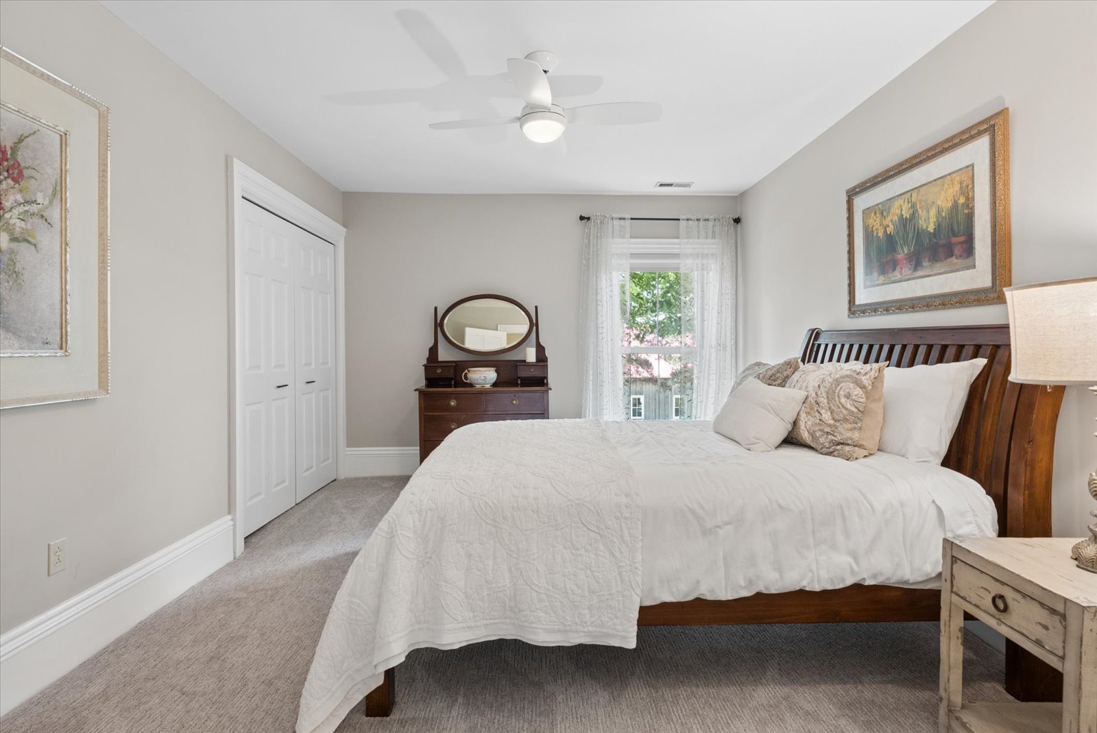 Bedroom with sleigh bed and soft morning light