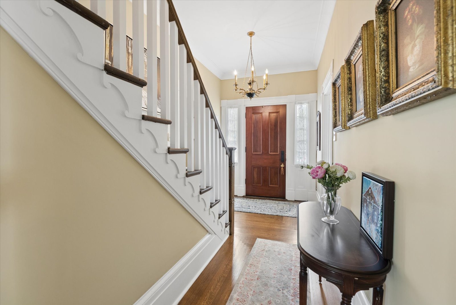 Centre hall with original staircase and antique chandelier