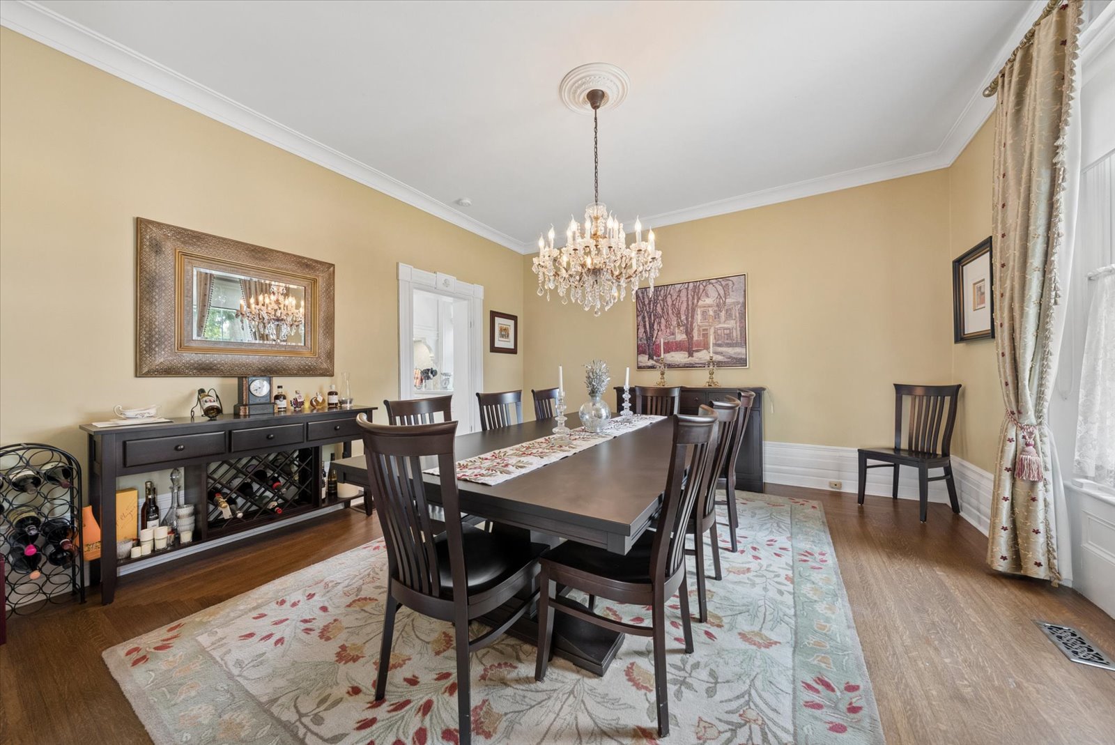 Dining room with buffet, wine storage and gilt mirror